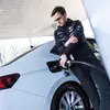 Miko Marczyk against the backdrop of the car