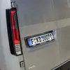 Мініатюра Kia PV5 WAV на парковці