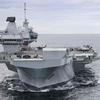 The British aircraft carrier HMS Queen Elizabeth, carrying fifth-generation F-35B Lightning II fighters, has transferred to NATO command for the first time in history-20