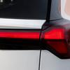 Chevrolet Bolt EV miniature in the background of the factory