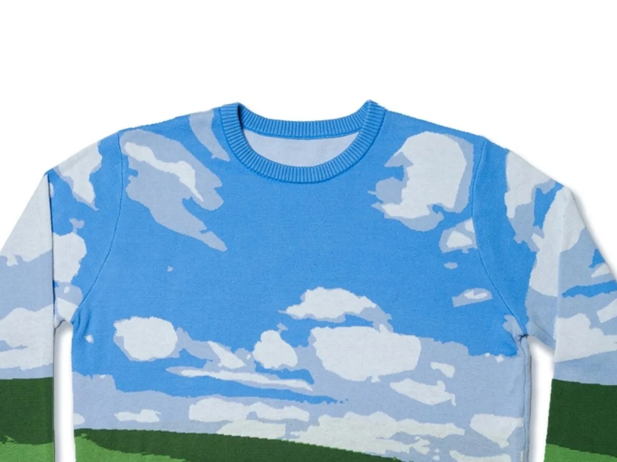 Microsoft a lancé un pull de Noël hideux dans le style du célèbre fond d'écran de Windows XP.