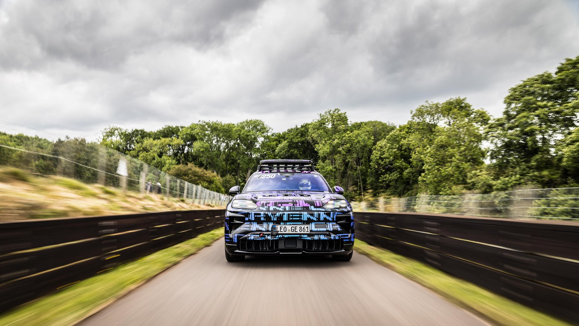 An electric Porsche Cayenne during the race
