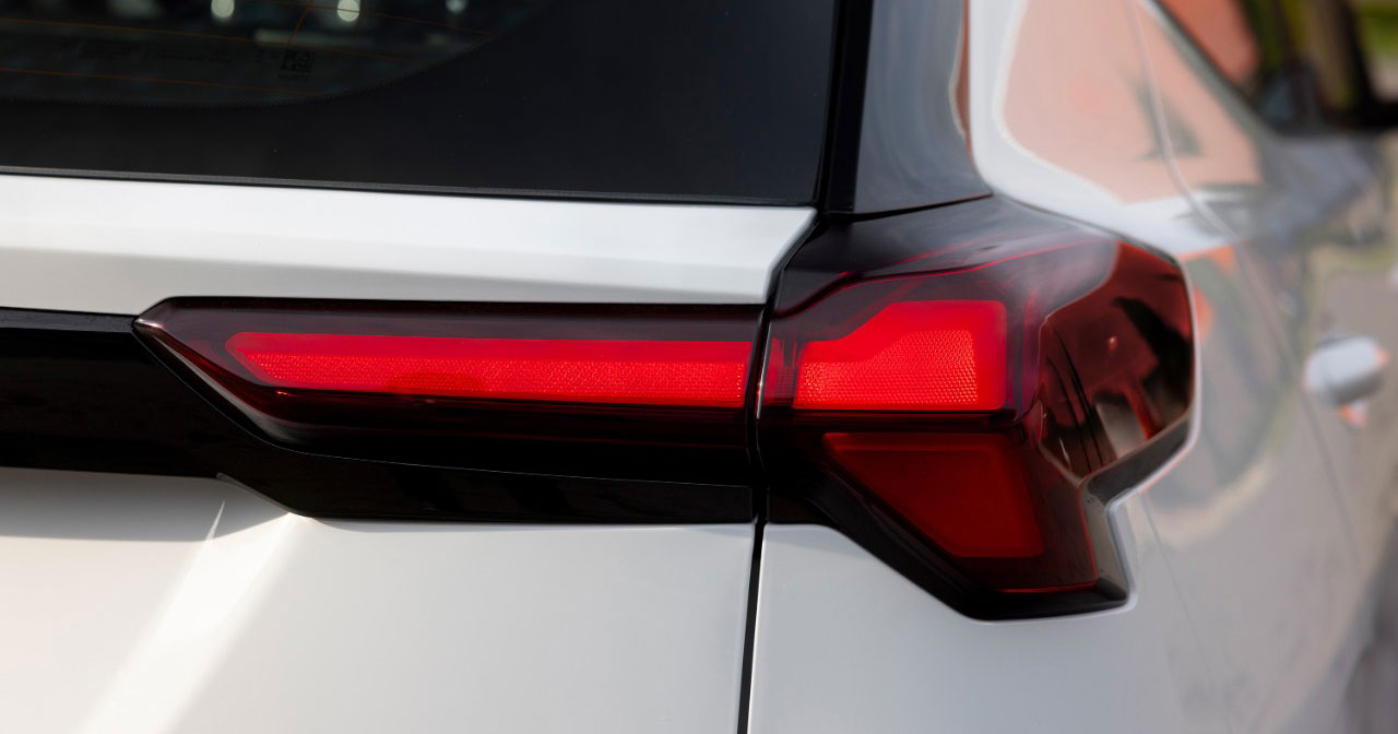 Image of the Chevrolet Bolt EV in the background of the factory