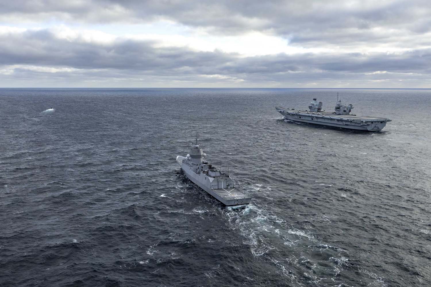 The British aircraft carrier HMS Queen Elizabeth, carrying fifth-generation F-35B Lightning II fighters, has transferred to NATO command for the first time in history-16