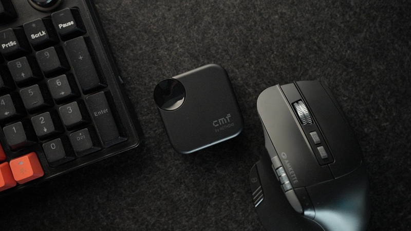 CMF Buds Neo earbuds with contact-style volume controller on the case.