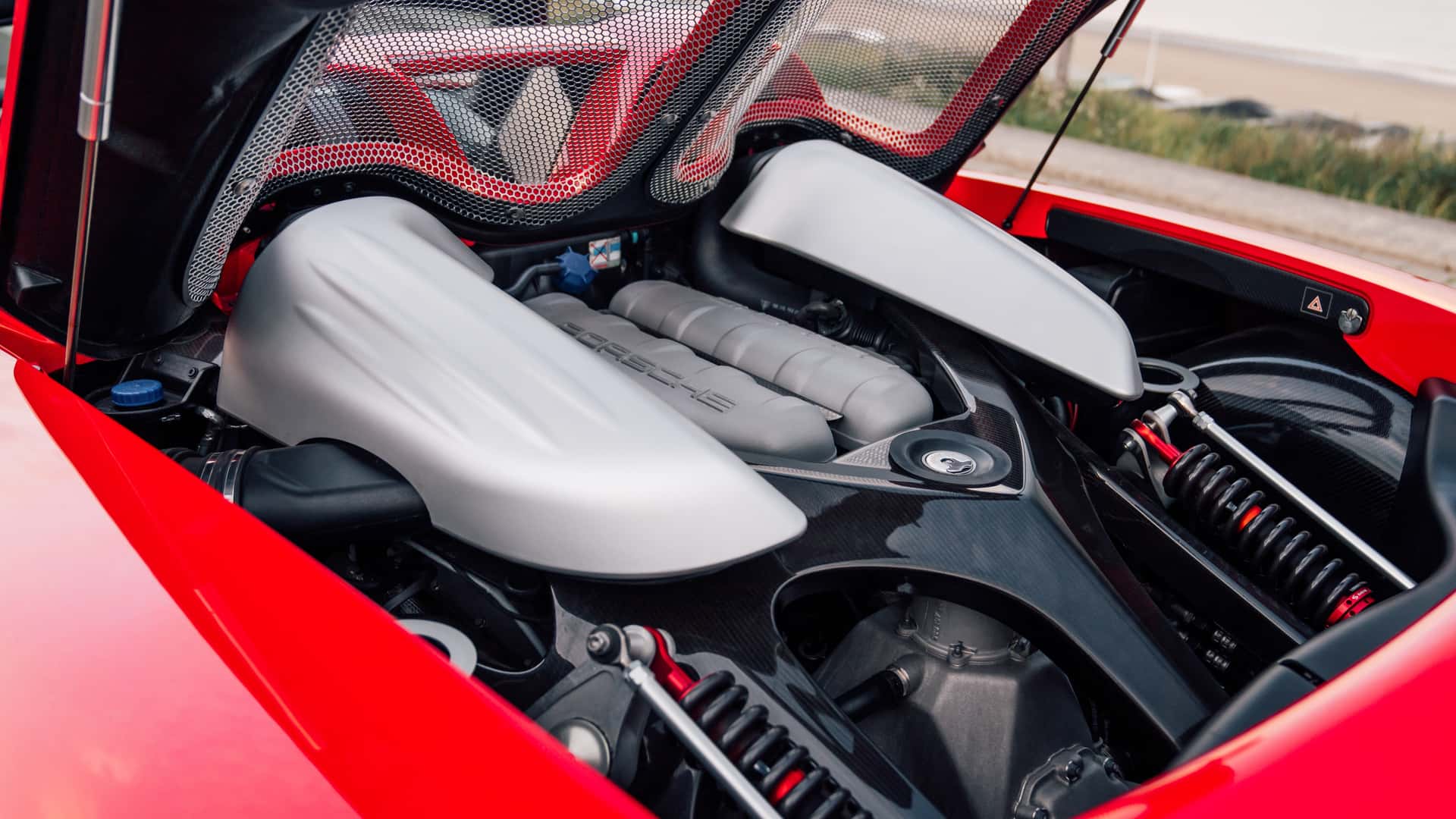 Front view of Porsche Carrera GT in Guards Red